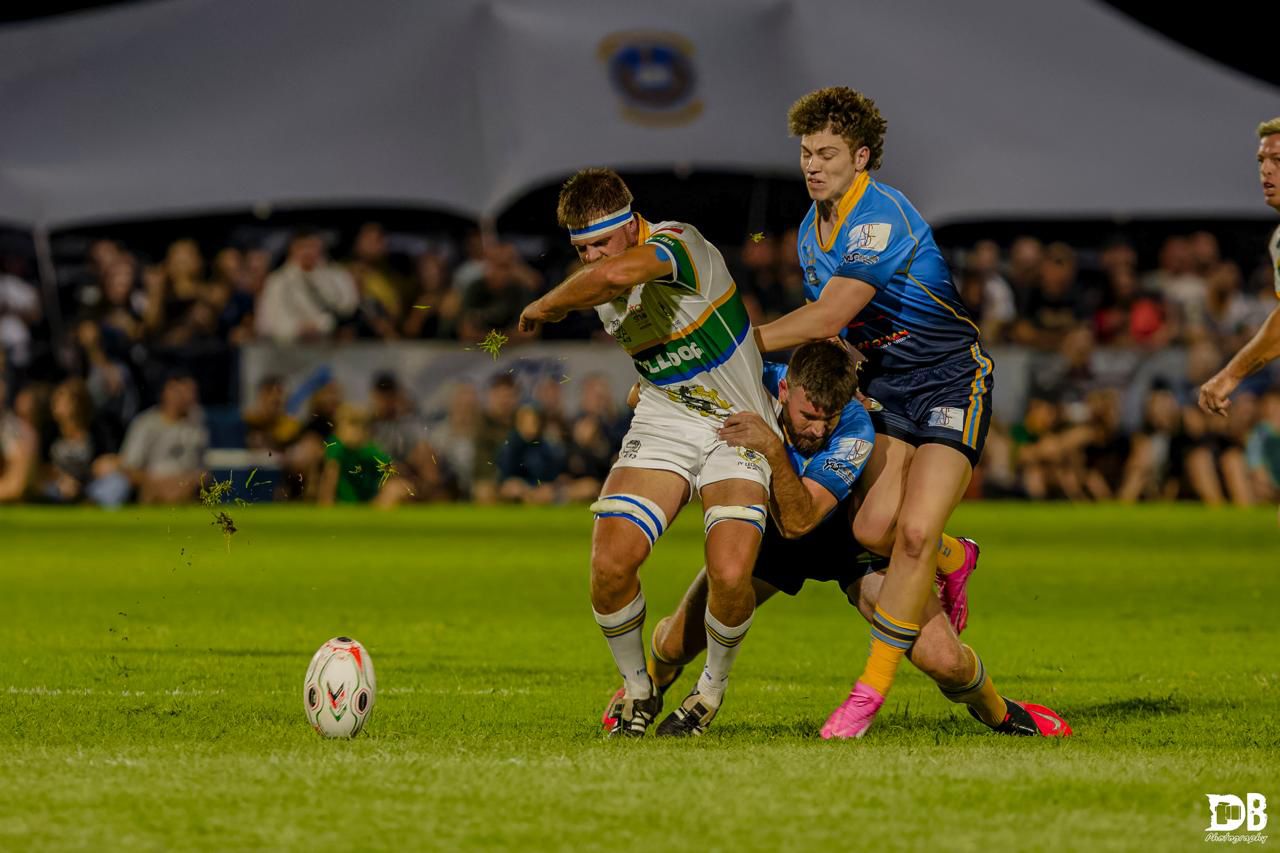 Rugby tackle action shot