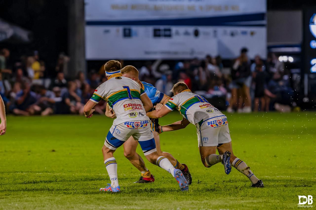 Rugby tackle action shot